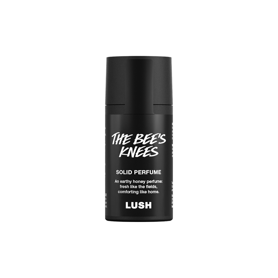 The Bee's Knees. A short, cylindrical black push-up tube of The Bee's Knees solid perfume with a black label on the front covering the cap, with the product name and scent printed on it.